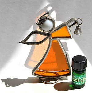 9 Blessings™ holy chrism photo of bottle with stained glass angel