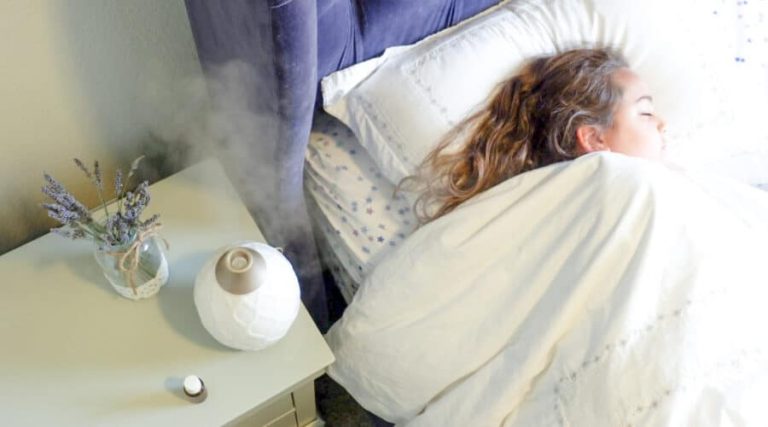 woman sleeping with oils diffuser